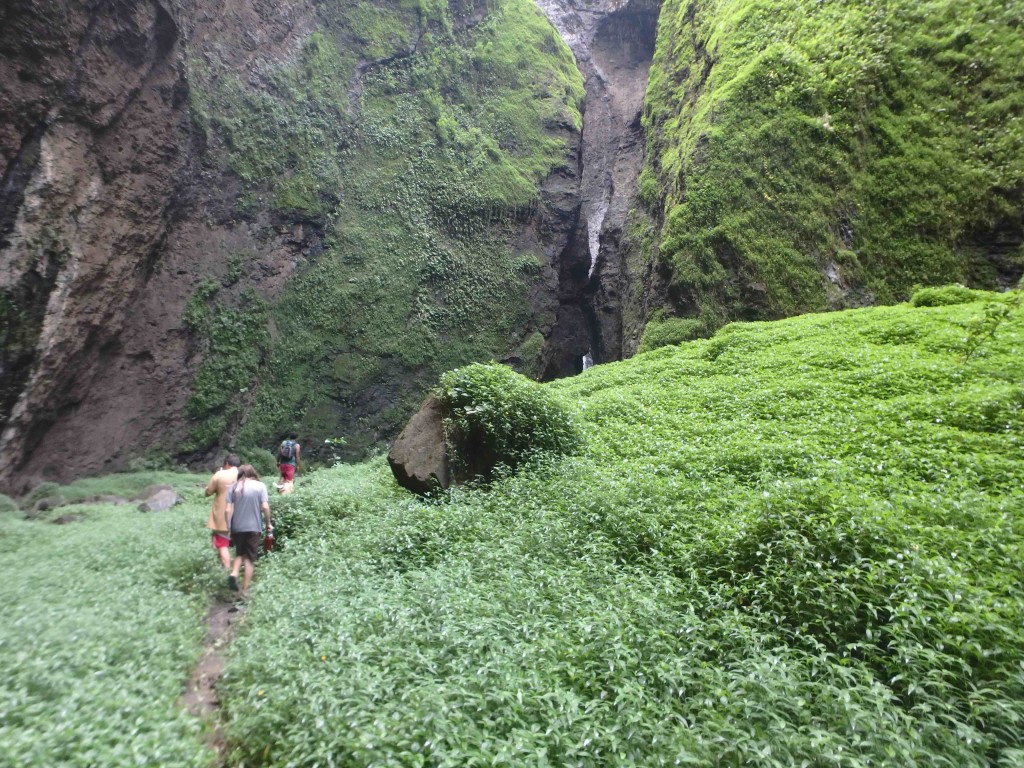 Approaching the Base - Our path to the base of the falls took us, swimming, through the crack